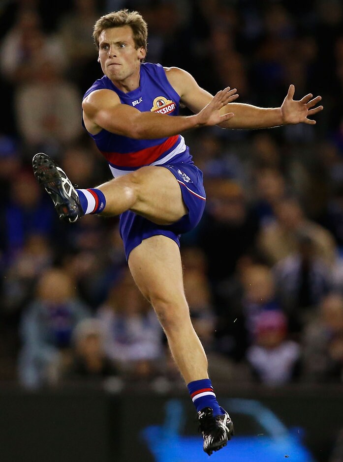 AFL 2015 Rd 17 - Western Bulldogs v Collingwood MELBOURNE, AUSTRALIA - JULY 26: Josh Prudden of the Bulldogs kicks the ball during the 2015 AFL round 17 match between the Western Bulldogs and the Collingwood Magpies at Etihad Stadium, Melbourne, Australia on July 26, 2015. (Photo by Adam Trafford/AFL Media)